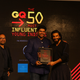 Gautom Menon receives an award from actor Ranveer Singh.